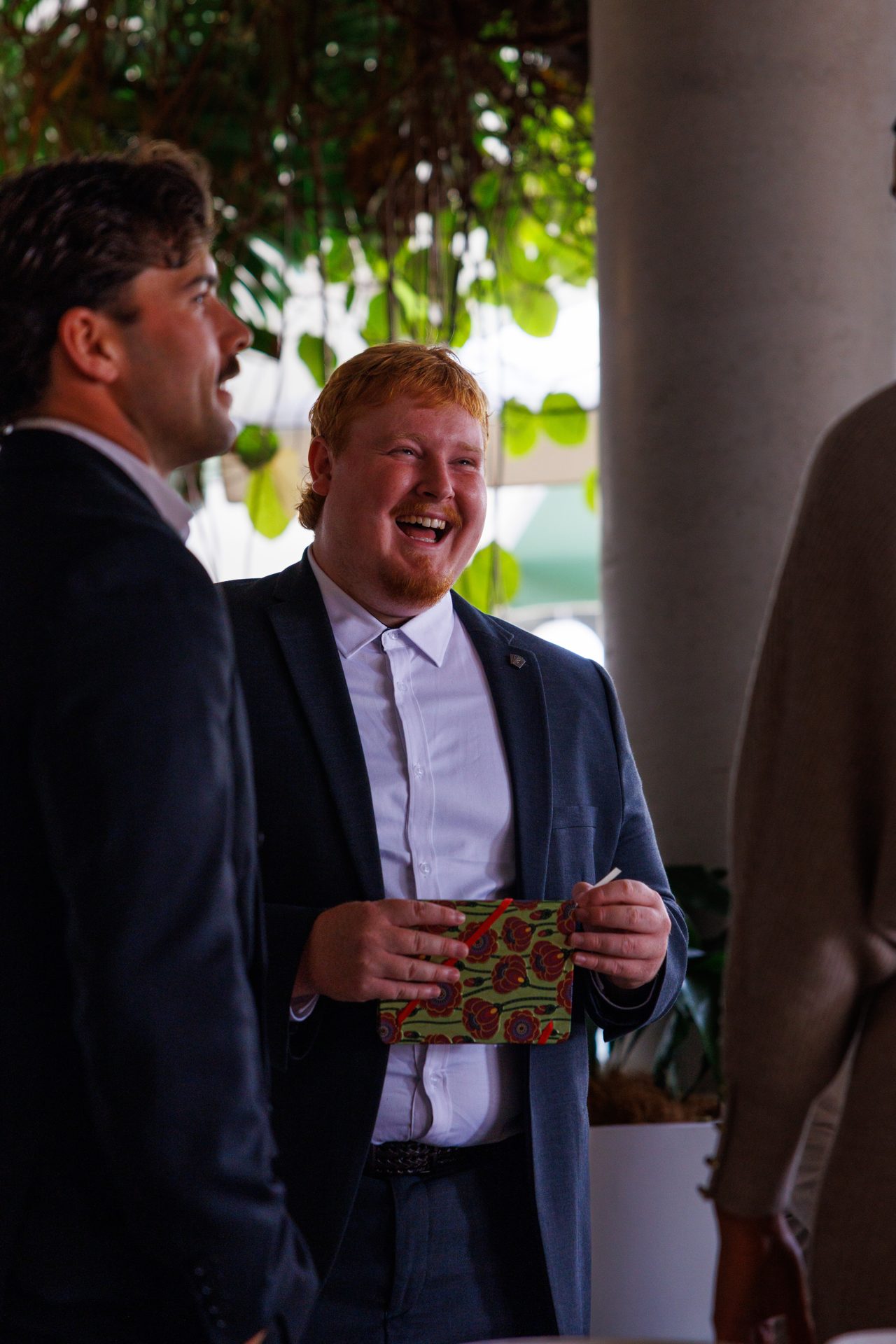 Team member laughing at an event